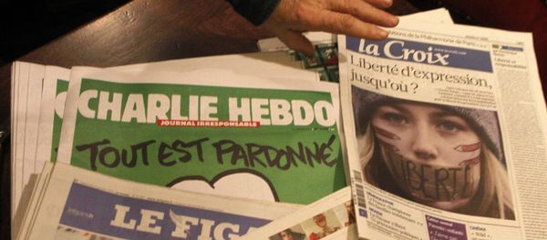 Copies of the latest issue of Charlie Hebdo newspaper are sold with other newspapers at a newsstand in Lille, northern France Copies of the latest issue of Charlie Hebdo newspaper are sold with other newspapers at a newsstand in Lille, northern France - Sputnik International
