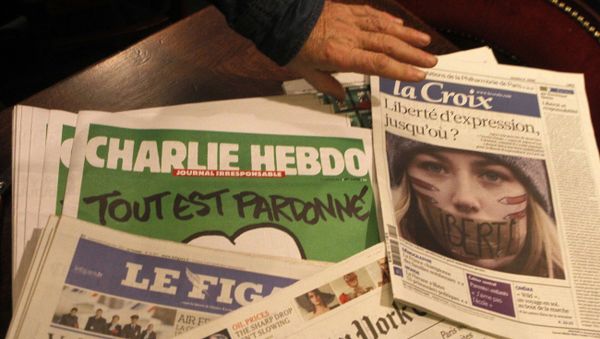 Copies of the latest issue of Charlie Hebdo newspaper are sold with other newspapers at a newsstand in Lille, northern France Copies of the latest issue of Charlie Hebdo newspaper are sold with other newspapers at a newsstand in Lille, northern France - Sputnik International