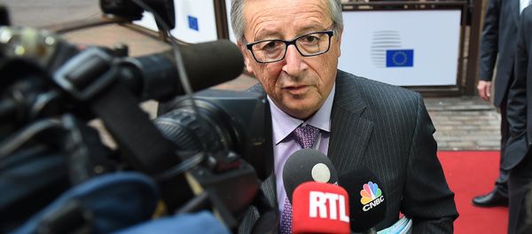 European Commission President Jean-Claude Juncker addresses reporters as he arrives to attend a Eurogroup finance ministers meeting at the European Council in Brussels, on January 26, 2015 - Sputnik International