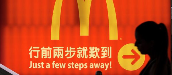 A woman walks past a logo of McDonald's in Hong Kong, in this file photo taken July 25, 2014 A woman walks past a logo of McDonald's in Hong Kong, in this file photo taken July 25, 2014 - Sputnik International