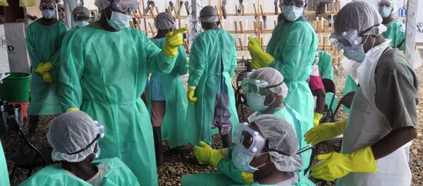Health care workers inside a USAID-funded Ebola clinic with their Ebola virus protective gear in Liberia Health care workers inside a USAID-funded Ebola clinic with their Ebola virus protective gear in Liberia - Sputnik International