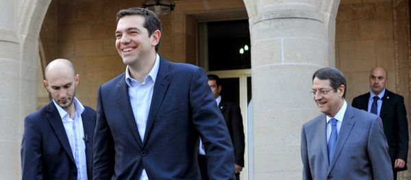 Greece's new Prime Minister Alexis Tsipras (2nd from L) leaves the presidential palace after a meeting with Cypriot President Nicos Anastasiades (R) Greece's new Prime Minister Alexis Tsipras (2nd from L) leaves the presidential palace after a meeting with Cypriot President Nicos Anastasiades (R) - Sputnik International