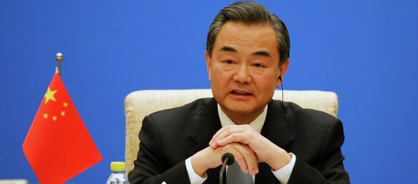 Chinese Foreign Minister Wang Yi speaks during the 13th Russia-India-China Foreign Ministers' Meeting, at Diaoyutai State Guesthouse in Beijing - Sputnik International