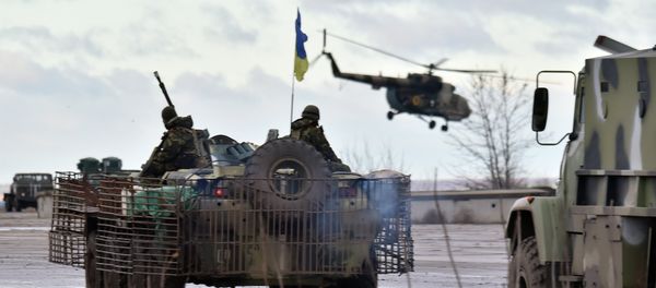 A Ukrainian helicopter flies above the headquarters of the Ukrainian forces in eastern Ukrainian city of Kramatorsk, in the Donetsk region - Sputnik International