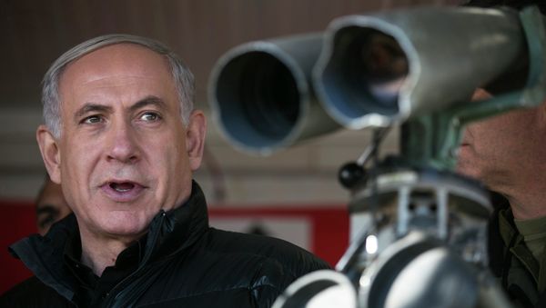 Israel's Prime Minister Benjamin Netanyahu visits at a military outpost during a visit at Mount Hermon in the Israeli-controlled Golan Heights overlooking the Israel-Syria border. - Sputnik International