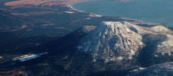 View of Mendeleev volcano and Yuzhno-Kurilsk village on Kunashir island. View of Mendeleev volcano and Yuzhno-Kurilsk village on Kunashir island. - Sputnik International