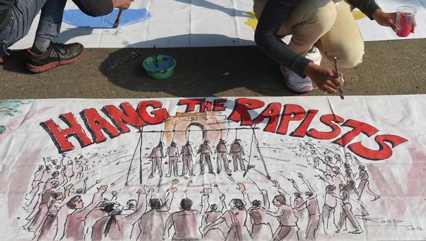 An Indian artist works on a banner condemning rape in New Delhi on December 16, 2014 An Indian artist works on a banner condemning rape in New Delhi on December 16, 2014 - Sputnik International