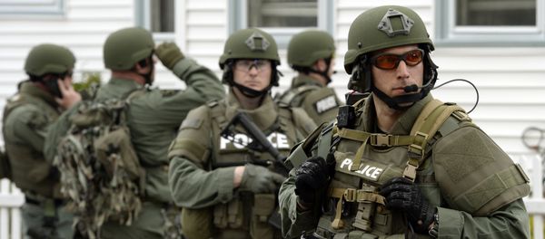 The six stand accused of sending material support, including military equipment, from the US to the Islamic State in Syria. Above: A police SWAT team search houses for the second of two suspects wanted in the Boston Marathon bombings. The six stand accused of sending material support, including military equipment, from the US to the Islamic State in Syria. Above: A police SWAT team search houses for the second of two suspects wanted in the Boston Marathon bombings. - Sputnik International