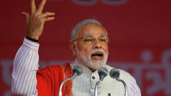 Indian Prime Minister Narendra Modi addresses an election campaign rally for his Bharatiya Janata Party (BJP) ahead of Delhi state election in New Delhi, India, Wednesday, Feb. 4, 2015 Indian Prime Minister Narendra Modi addresses an election campaign rally for his Bharatiya Janata Party (BJP) ahead of Delhi state election in New Delhi, India, Wednesday, Feb. 4, 2015 - Sputnik International