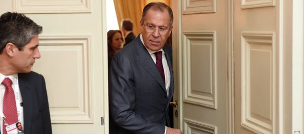 Russian Minister of Foreign Affairs Sergey Lavrov right, leaves a room after talks during the 51st Security Conference in Munich, Germany, Sunday Feb. 8, 2015 Russian Minister of Foreign Affairs Sergey Lavrov right, leaves a room after talks during the 51st Security Conference in Munich, Germany, Sunday Feb. 8, 2015 - Sputnik International