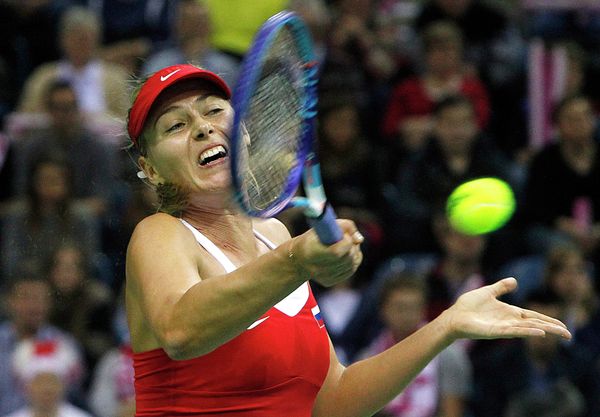 Maria Sharapova of Russia returns the ball to Agnieszka Radwanska of Poland during the Fed Cup World Group first round match between Poland and Russiain Krakow, Poland, Sunday, Feb. 8, 2015 Maria Sharapova of Russia returns the ball to Agnieszka Radwanska of Poland during the Fed Cup World Group first round match between Poland and Russiain Krakow, Poland, Sunday, Feb. 8, 2015 - Sputnik International