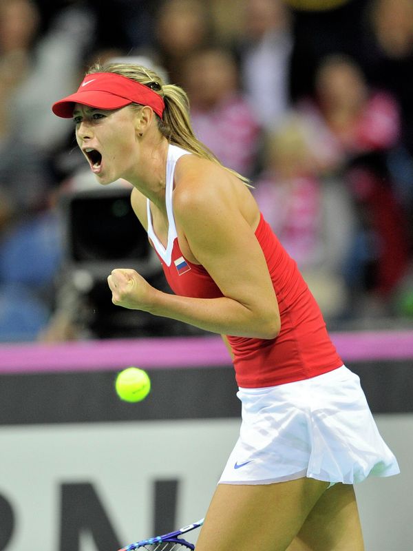 Russia's Maria Sharapova reacts during her match against Poland's Agnieszka Radwanska during their Fed Cup World Group 1st round tennis match between Poland and Russia in Krakow, Poland on February 8, 2015 Russia's Maria Sharapova reacts during her match against Poland's Agnieszka Radwanska during their Fed Cup World Group 1st round tennis match between Poland and Russia in Krakow, Poland on February 8, 2015 - Sputnik International