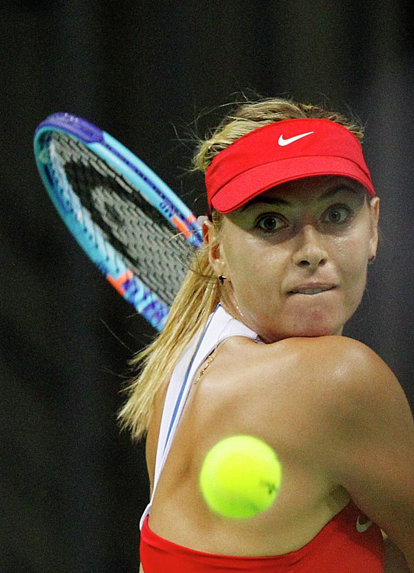 Maria Sharapova of Russia returns a ball to Agnieszka Radwanska of Poland during the Fed Cup World Group first round tennis match between Poland and Russia in Krakow, Poland, Sunday, Feb. 8, 2015 Maria Sharapova of Russia returns a ball to Agnieszka Radwanska of Poland during the Fed Cup World Group first round tennis match between Poland and Russia in Krakow, Poland, Sunday, Feb. 8, 2015 - Sputnik International