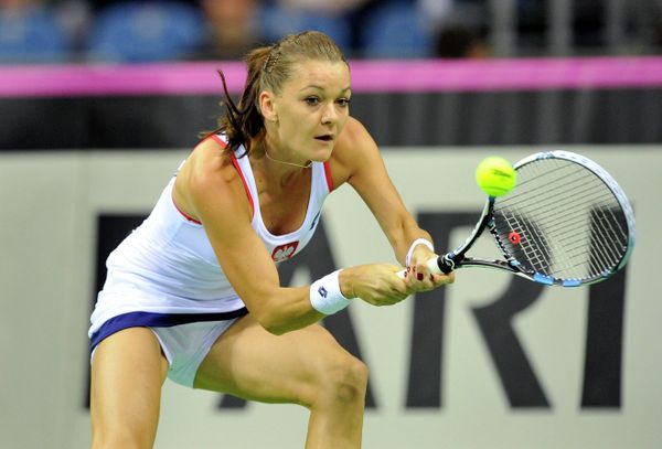 Poland's Agnieszka Radwanska returns the ball to Russia's Maria Sharapova during their Fed Cup World Group 1st round tennis match between Poland and Russia in Krakow, Poland on February 8, 2015 Poland's Agnieszka Radwanska returns the ball to Russia's Maria Sharapova during their Fed Cup World Group 1st round tennis match between Poland and Russia in Krakow, Poland on February 8, 2015 - Sputnik International