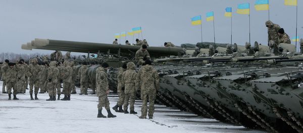 Ukrainian servicemen stand near armored vehicles during a ceremony with Ukrainian President Petro Poroshenko to mark the delivery of more than 100 pieces of military equipment to the Ukrainian armed forces, near Zhitomir, Ukraine, Jan. 5, 2015 Ukrainian servicemen stand near armored vehicles during a ceremony with Ukrainian President Petro Poroshenko to mark the delivery of more than 100 pieces of military equipment to the Ukrainian armed forces, near Zhitomir, Ukraine, Jan. 5, 2015 - Sputnik International