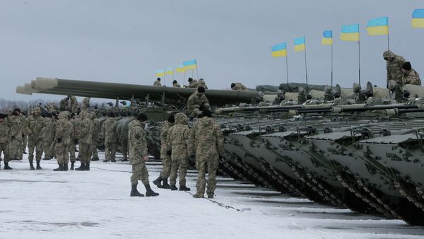 Ukrainian servicemen stand near armored vehicles during a ceremony with Ukrainian President Petro Poroshenko to mark the delivery of more than 100 pieces of military equipment to the Ukrainian armed forces, near Zhitomir, Ukraine, Jan. 5, 2015 Ukrainian servicemen stand near armored vehicles during a ceremony with Ukrainian President Petro Poroshenko to mark the delivery of more than 100 pieces of military equipment to the Ukrainian armed forces, near Zhitomir, Ukraine, Jan. 5, 2015 - Sputnik International