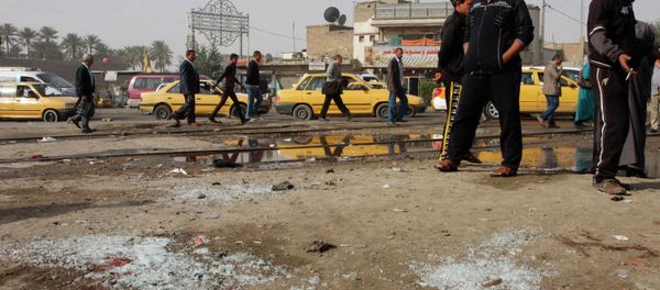 People gather at the site of a suicide bombing attack in the Shi'ite neighborhood of Kadhimiya in Baghdad February 9, 2015 People gather at the site of a suicide bombing attack in the Shi'ite neighborhood of Kadhimiya in Baghdad February 9, 2015 - Sputnik International