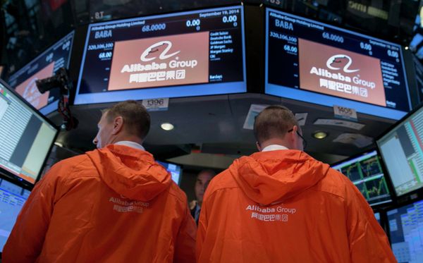 Specialist traders work at the post that trades Alibaba Group Holding Ltd during the company's initial public offering (IPO) under the ticker BABA at the New York Stock Exchange in New York in this September 19, 2014 file photo Specialist traders work at the post that trades Alibaba Group Holding Ltd during the company's initial public offering (IPO) under the ticker BABA at the New York Stock Exchange in New York in this September 19, 2014 file photo - Sputnik International