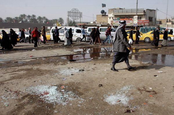 Broken glass remains at the scene of a suicide bomb attack at Adan Square in Baghdad. Broken glass remains at the scene of a suicide bomb attack at Adan Square in Baghdad. - Sputnik International