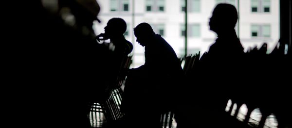 Homeowners wait to speak with a bank associate in an attempt to lower their monthly mortgage payments Homeowners wait to speak with a bank associate in an attempt to lower their monthly mortgage payments - Sputnik International