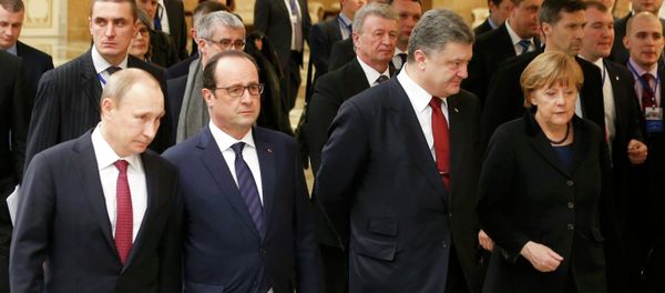 Russia's President Vladimir Putin (L, front), Ukraine's President Petro Poroshenko (2nd R, front), Germany's Chancellor Angela Merkel (R, front) and France's President Francois Hollande (2nd L, front) walk during peace talks in Minsk Russia's President Vladimir Putin (L, front), Ukraine's President Petro Poroshenko (2nd R, front), Germany's Chancellor Angela Merkel (R, front) and France's President Francois Hollande (2nd L, front) walk during peace talks in Minsk - Sputnik International