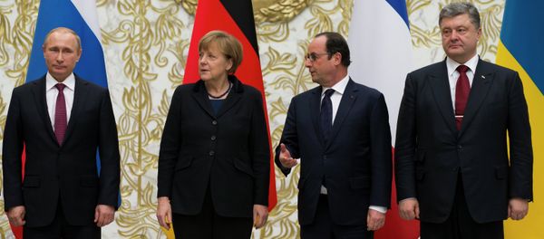 From the left : Russian President Vladimir Putin, German Chancellor Angela Merkel, French President Francois Hollande, and Ukrainian President Petro Poroshenko pose for a photo during a time-break in their peace talks in Minsk, Belarus From the left : Russian President Vladimir Putin, German Chancellor Angela Merkel, French President Francois Hollande, and Ukrainian President Petro Poroshenko pose for a photo during a time-break in their peace talks in Minsk, Belarus - Sputnik International