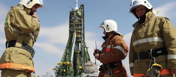 Russian Emergency Situations Ministry staff provide security on the launch pad before launch of the Soyuz TMA-21 Gagarin at the Baikonur Cosmodrome - Sputnik International
