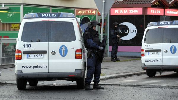 Police officers guard the area in Hyvinkaa, Finland, where a gunman has killed one person and wounded eight others in what appeared to be a random shooting, police said Saturday May 26, 2012 - Sputnik International