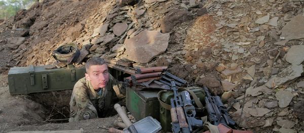 A Ukrainian army soldier examines his shelter at a position in Debaltsevo, Donetsk region, Ukraine, Friday, Sept. 12, 2014 A Ukrainian army soldier examines his shelter at a position in Debaltsevo, Donetsk region, Ukraine, Friday, Sept. 12, 2014 - Sputnik International