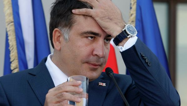 Georgian President Mikhail Saakashvili gestures during a news conference with NATO Secretary General Anders Fogh Rasmussen in the presidential palace in Tbilisi on June 27, 2013 Georgian President Mikhail Saakashvili gestures during a news conference with NATO Secretary General Anders Fogh Rasmussen in the presidential palace in Tbilisi on June 27, 2013 - Sputnik International