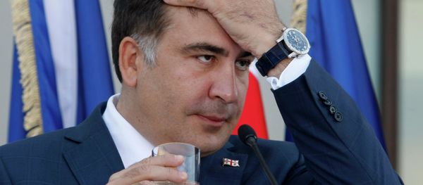 Georgian President Mikhail Saakashvili gestures during a news conference with NATO Secretary General Anders Fogh Rasmussen in the presidential palace in Tbilisi on June 27, 2013 Georgian President Mikhail Saakashvili gestures during a news conference with NATO Secretary General Anders Fogh Rasmussen in the presidential palace in Tbilisi on June 27, 2013 - Sputnik International