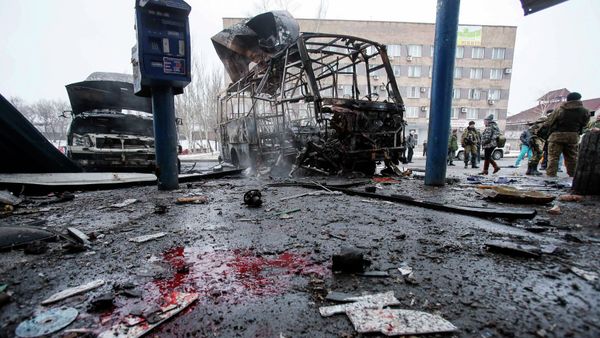 Destroyed vehicles, debris and blood on the ground are seen at a bus station after shelling in Donetsk, February 11, 2015 Destroyed vehicles, debris and blood on the ground are seen at a bus station after shelling in Donetsk, February 11, 2015 - Sputnik International