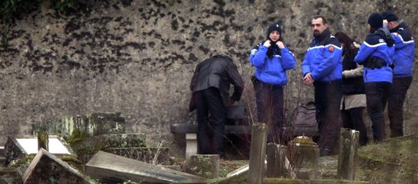 Police officers investigate the site of defaced tombstones at the Jewish cemetery of Sarre-Union, eastern France, Monday, Feb. 16, 2015 Police officers investigate the site of defaced tombstones at the Jewish cemetery of Sarre-Union, eastern France, Monday, Feb. 16, 2015 - Sputnik International