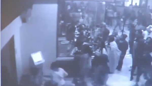 Screenshot of security camera footage from a Florida theater in which 900 teens rampaged through for free movies Screenshot of security camera footage from a Florida theater in which 900 teens rampaged through for free movies - Sputnik International