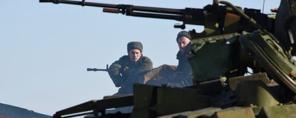 In this Wednesday, Jan. 14, 2015 photo members of the armed forces of the self-proclaimed Luhansk People's Republic sit on top a tank at the check-point north of Luhansk, Eastern Ukraine - Sputnik International
