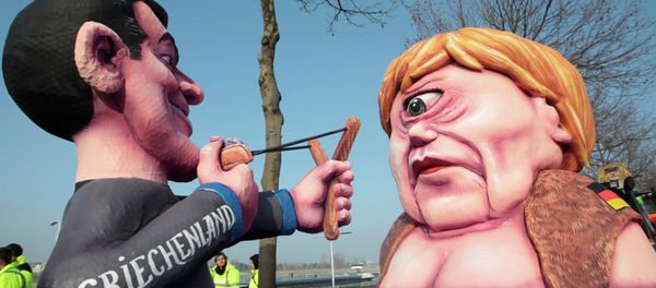 A carnival float with papier-mache caricatures of German Chancellor Angela Merkel (R) and a figure representing Greece (L) takes part in the traditional Rose Monday carnival parade in the western German city of Duesseldorf February 16, 2015 - Sputnik International