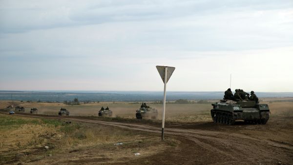A number of Russian APC's move in a field in about 10 kilometers from the Russia-Ukrainian border control point near the town of Donetsk, Rostov-on-Don region, Russia, Monday, Aug. 18, 2014. File Photo. - Sputnik International
