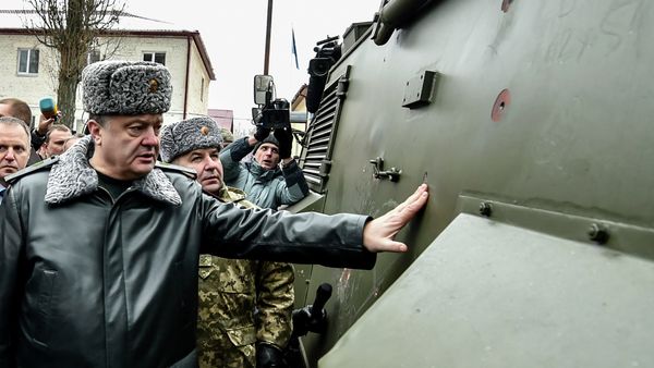 Ukraine's President Petro Poroshenko inspects a British Saxon military vehicle for its bullet proof capabilities at the National Guard Training Center in Novy Petrivtsy, Ukraine, Friday, Feb. 13, 2015 Ukraine's President Petro Poroshenko inspects a British Saxon military vehicle for its bullet proof capabilities at the National Guard Training Center in Novy Petrivtsy, Ukraine, Friday, Feb. 13, 2015 - Sputnik International