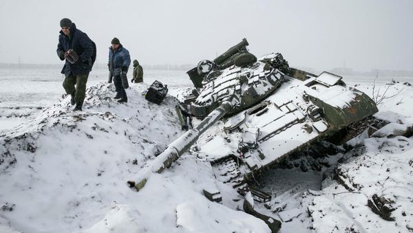 Members of the self-proclaimed Donetsk People's Republic army collect parts of a destroyed Ukrainian army tank in the town of Vuhlehirsk, about 10 km (6 miles) to the west of Debaltseve, February 16, 2015 Members of the self-proclaimed Donetsk People's Republic army collect parts of a destroyed Ukrainian army tank in the town of Vuhlehirsk, about 10 km (6 miles) to the west of Debaltseve, February 16, 2015 - Sputnik International