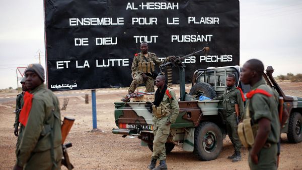 The sign , a reminder of Islamic extremists, reads  Al Hesbah, together for the pleasure of God almighty and the struggle against sins. - Sputnik International
