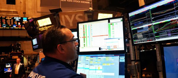 A trader works on the floor of the New York Stock Exchange (NYSE) on February 6, 2015, in New York - Sputnik International