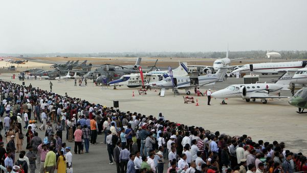 Visitors look at aircraft parked at the static display area on the third day of Aero India 2013 at Yelahanka Air Force station in Bangalore on February 8, 2013. File photo Visitors look at aircraft parked at the static display area on the third day of Aero India 2013 at Yelahanka Air Force station in Bangalore on February 8, 2013. File photo - Sputnik International