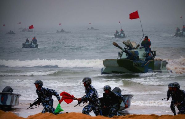 Amphibious tanks and Marine Corps soldiers rush to the beachhead in an amphibious landing drill during the third phase of the Sino-Russian joint military exercise, held in China's Shandong Peninsula (File) Amphibious tanks and Marine Corps soldiers rush to the beachhead in an amphibious landing drill during the third phase of the Sino-Russian joint military exercise, held in China's Shandong Peninsula (File) - Sputnik International