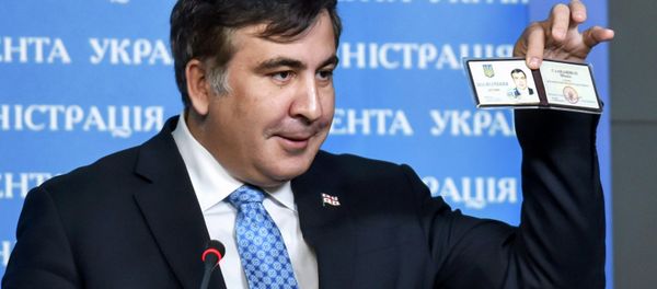 Former Georgia's President Mikheil Saakashvili shows off his identification card as the head of an advisory council in Kiev, in this February 17, 2015 handout photo supplied by the Ukrainian Presidential Press Service Former Georgia's President Mikheil Saakashvili shows off his identification card as the head of an advisory council in Kiev, in this February 17, 2015 handout photo supplied by the Ukrainian Presidential Press Service - Sputnik International