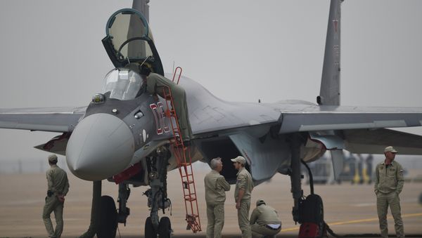 A Sukhoi SU-35 fighter jet is displayed before a test flight ahead of the Airshow China 2014 in Zhuhai, South China's Guangdong province - Sputnik International