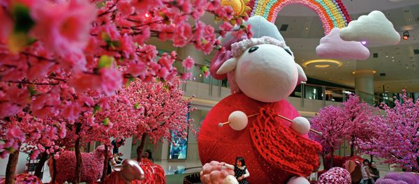 A girl touches a goat decoration as a shopping mall floor is decorated with goat installation to celebrate the upcoming Chinese Lunar New Year in Hong Kong A girl touches a goat decoration as a shopping mall floor is decorated with goat installation to celebrate the upcoming Chinese Lunar New Year in Hong Kong - Sputnik International