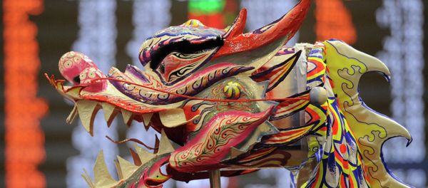 A performer raises a dragon head as part of a dance performance at the Philippine stock exchange for Lunar New Year of the Sheep celebrations in Manila - Sputnik International