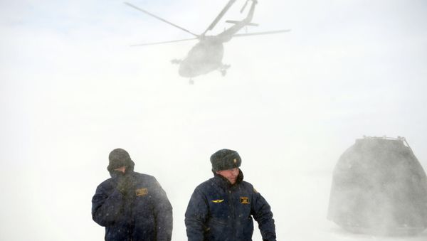 Rescuers from the Central Military District and experts from the Roscosmos space agency and the Federal Air Transport Agency during a training to search and evacuate the Soyuz TMA crew return vehicle Rescuers from the Central Military District and experts from the Roscosmos space agency and the Federal Air Transport Agency during a training to search and evacuate the Soyuz TMA crew return vehicle - Sputnik International