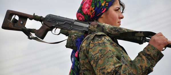 A Kurdish female fighter of the Women's Protection Units (YPJ) looks on at a training camp in al-Qahtaniyah, near the Syrian-Turkish border A Kurdish female fighter of the Women's Protection Units (YPJ) looks on at a training camp in al-Qahtaniyah, near the Syrian-Turkish border - Sputnik International