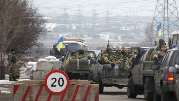 Ukrainian government troops sit in the back of pick-up trucks as they pass a checkpoint near the town of Mariupol, Ukraine Ukrainian government troops sit in the back of pick-up trucks as they pass a checkpoint near the town of Mariupol, Ukraine - Sputnik International